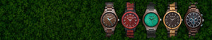 TruWood wooden watches displayed on green leaf background – natural wood watch collection featuring unique eco-friendly designs.